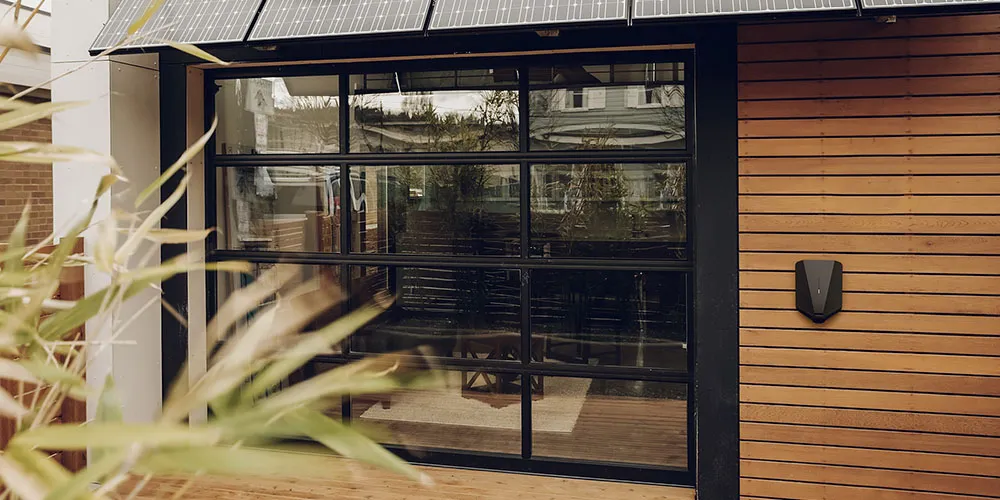 Modern house in Wimbledon - Eassee EV charger on the wall